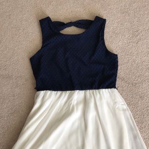 Sleeveless white and blue summer dress.